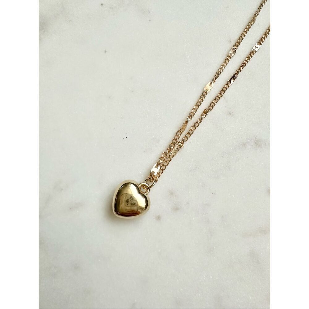 Sleek gold color heart pendant necklace